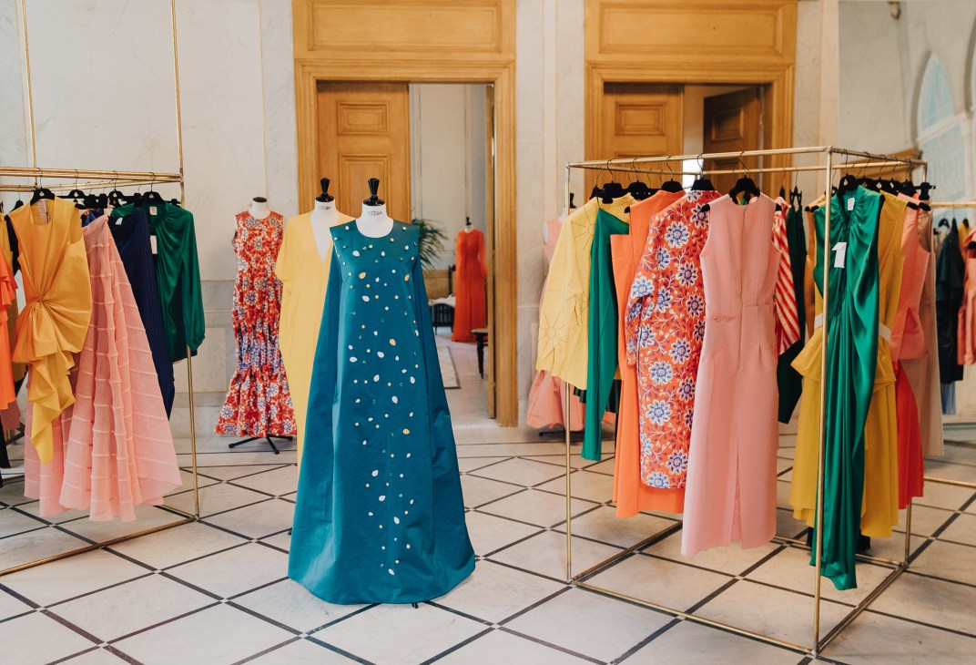 Rabih Kayrouz womenswear dresses displayed on mannequins and racks in the 19th-century mansion boutique.