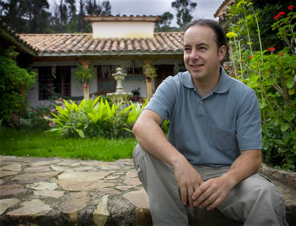 Oscar Gilede, a biologist, poses in the garden of a colonial house in Villa de Leyva.