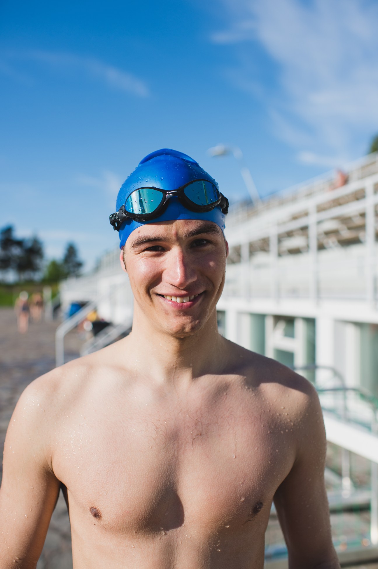 Jere Viljanen, a swimmer at Helsinki Swimming Stadium, wearing a blue cap and goggles.