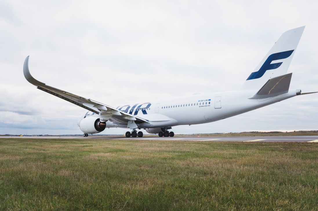 Finnair's Airbus A350 aircraft on tarmac with white fuselage and blue tail livery.