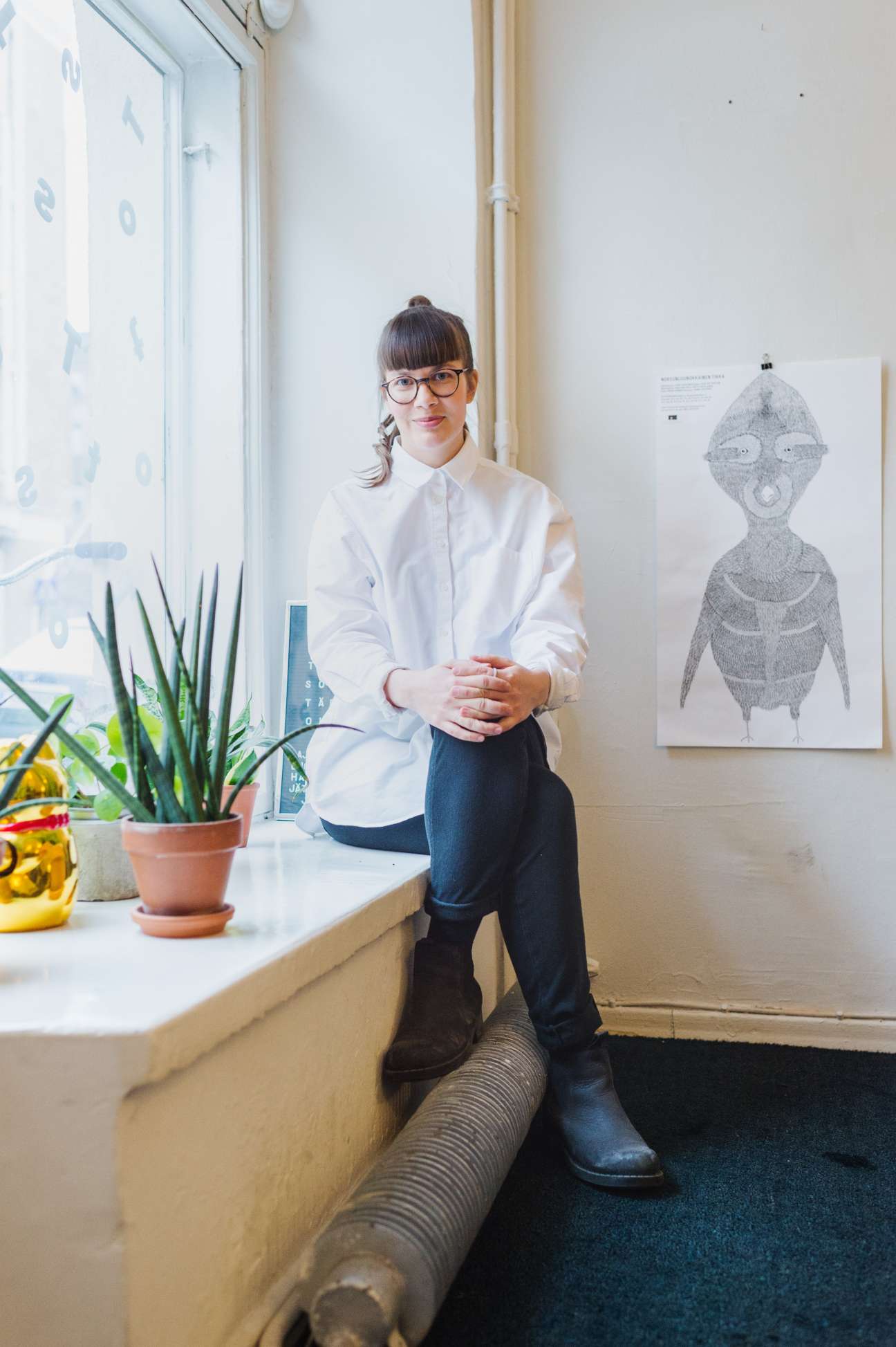 Designer Inka Järvinen stands in her studio at design agency Tsto in Helsinki's Punavuori district.