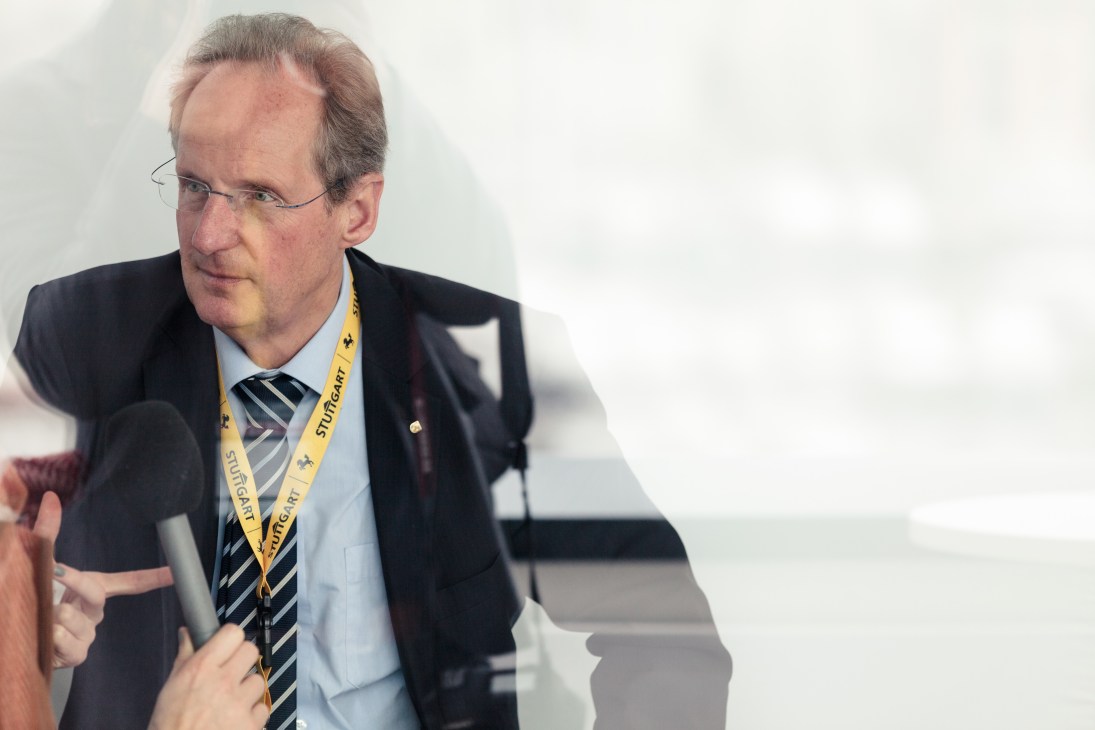 Wolfgang Schuster, mayor of Stuttgart, wearing a yellow lanyard and striped tie at the MIPIM conference.