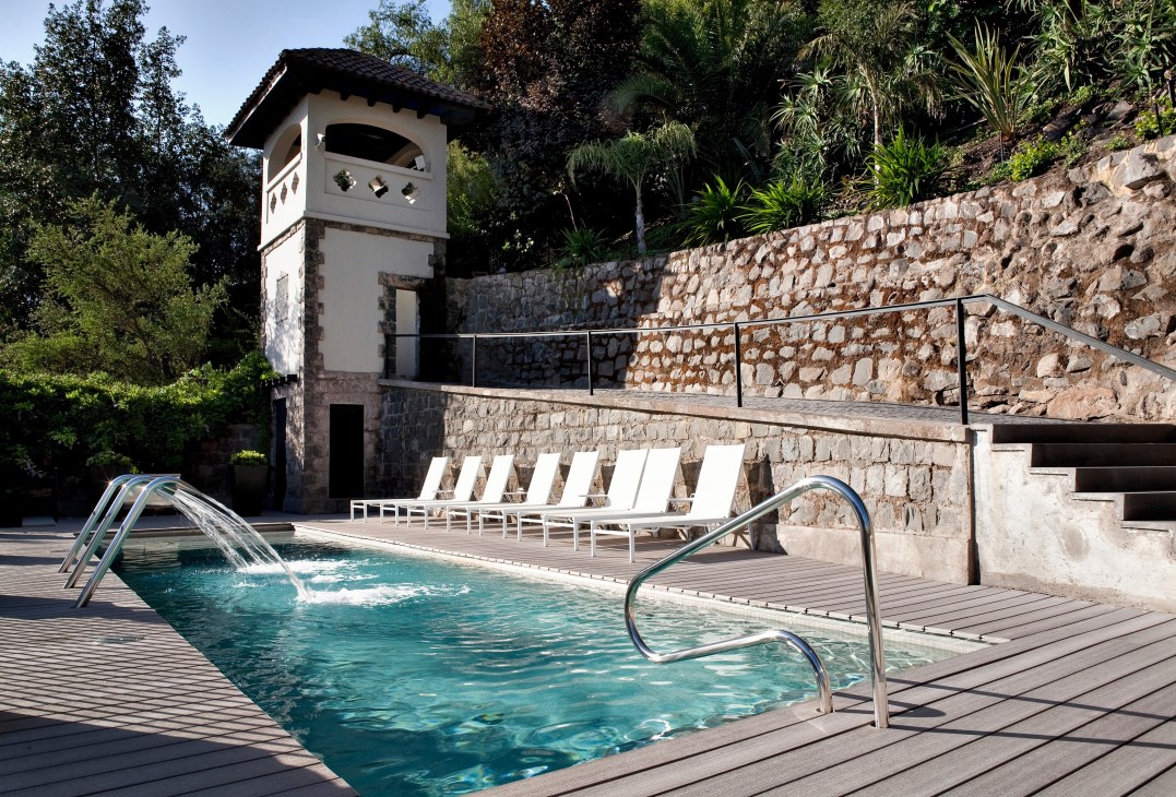 The Aubrey hotel's terraced pool with mountain views in Santiago, Chile.