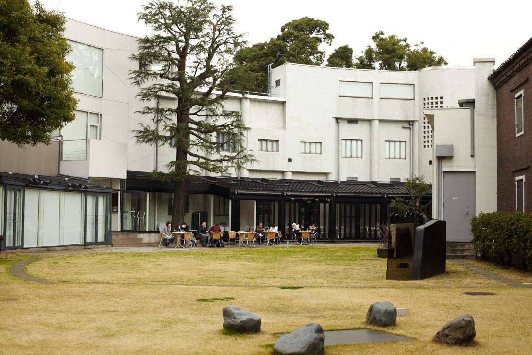 Hara Museum of Contemporary Art's 1938 Bauhaus-style villa with modern extension, courtyard, and tree.