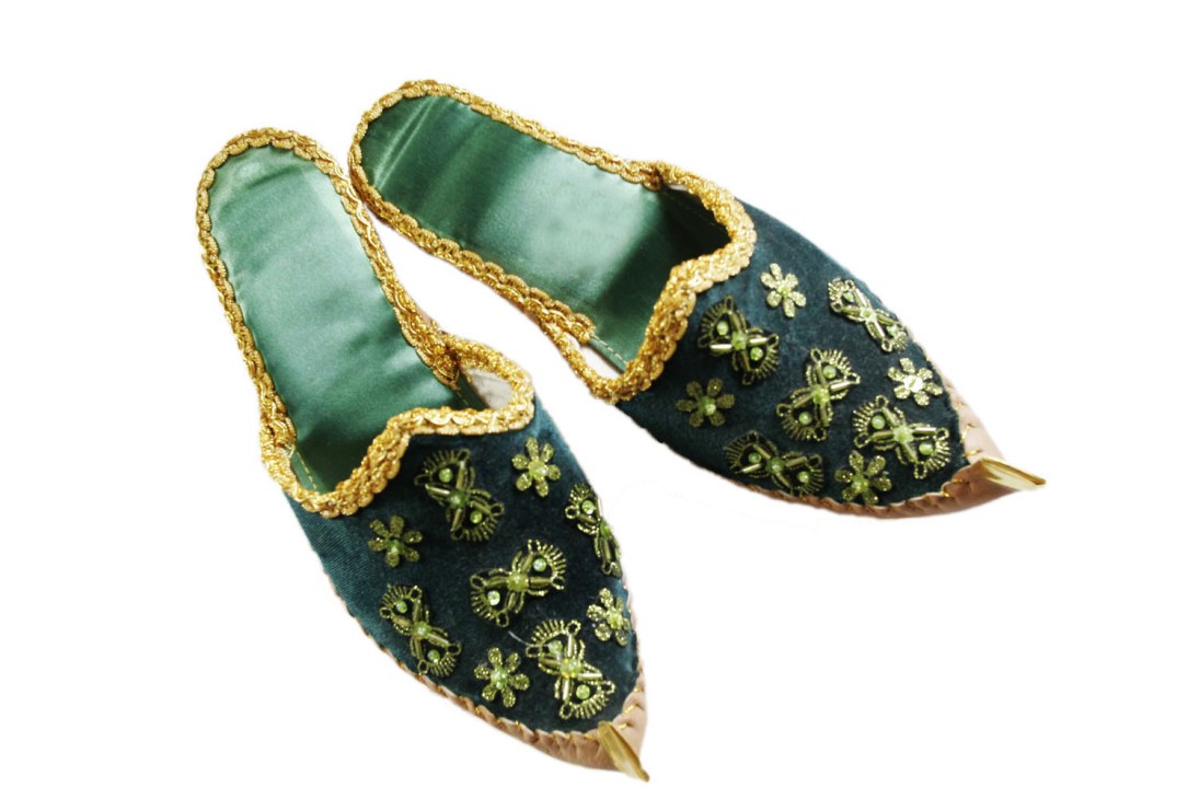 Pair of traditional Azeri slippers with dark green embroidered fabric, gold trim, and pointed curled toes.