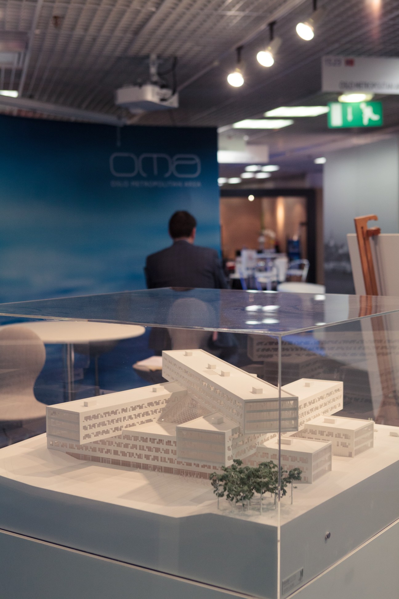White architectural model of Statoil project displayed in a glass case at MIPIM exhibition booth.