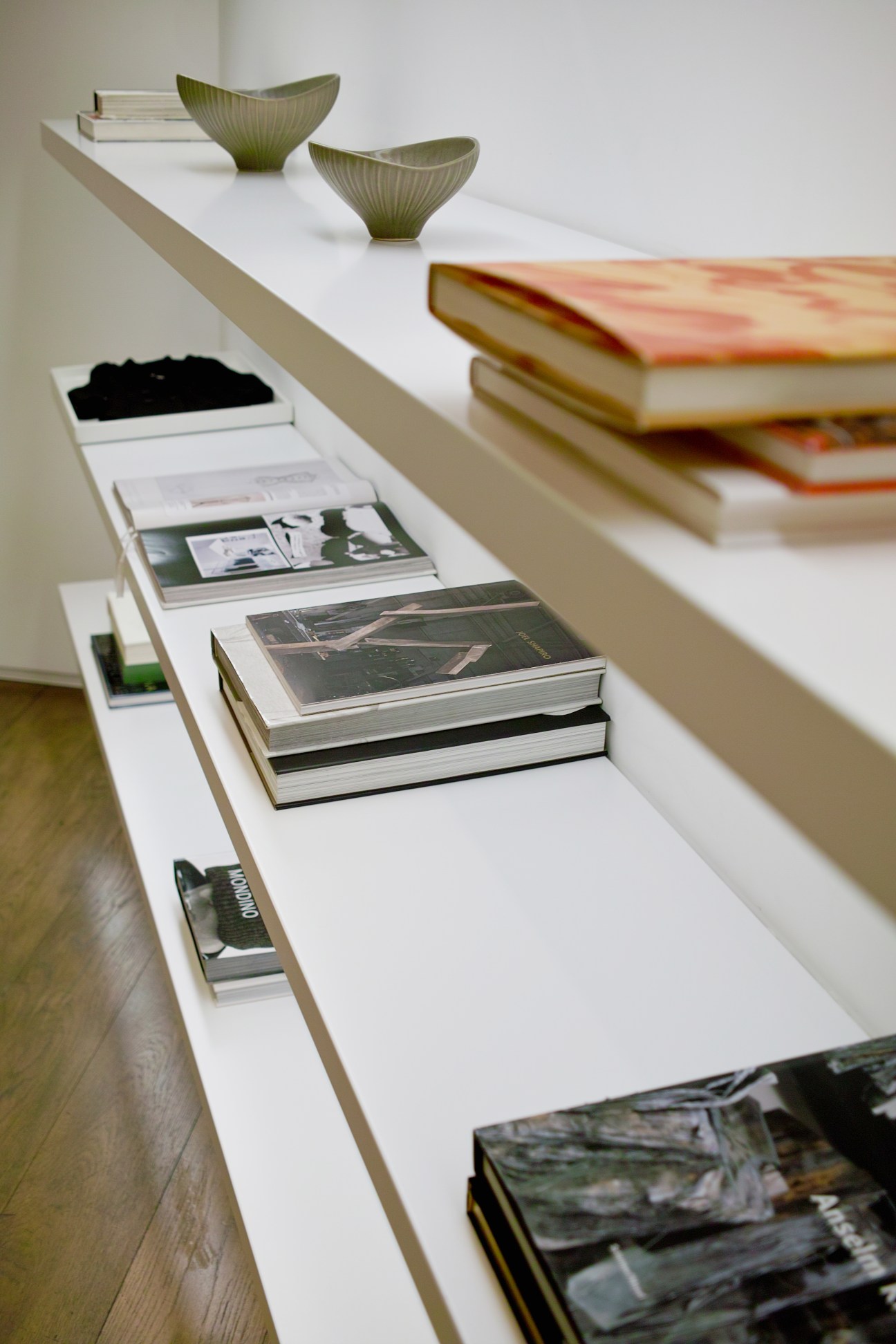 Display in the VIP room at Boon The Shop women's flagship store with books, bowls and magazines on white shelving.