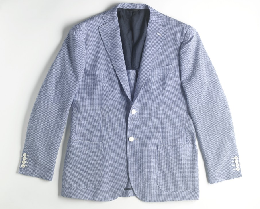 Light blue seersucker jacket with two-button front and white mother-of-pearl buttons.
