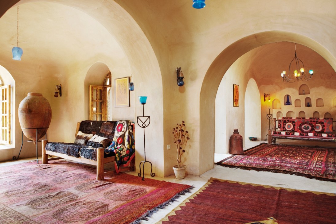 Interior of Rahim Walizada's design centre in Kabul featuring traditional Afghan rugs and furnishings.