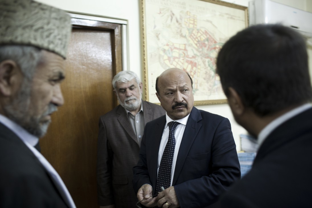 Mohammad Yunus Nawandish, Mayor of Kabul, meets with officials in an interior office setting.