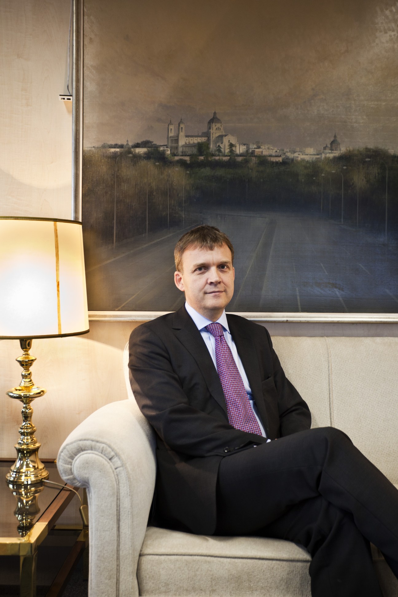 Stefan Haukur Johannesson, Iceland's ambassador and chief negotiator for EU accession, seated in an office with a landscape painting behind him.