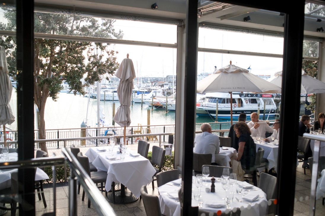Soul Bar and Bistro waterfront dining area with harbor and boats visible through large windows.