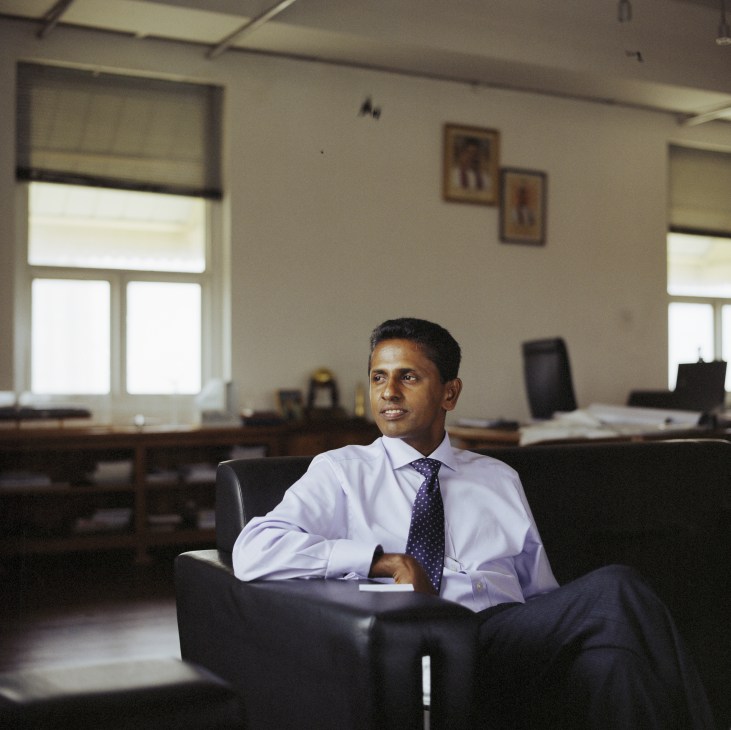 Dr Priyath Wickrama, chairman of Sri Lanka Ports Authority, seated in an office.