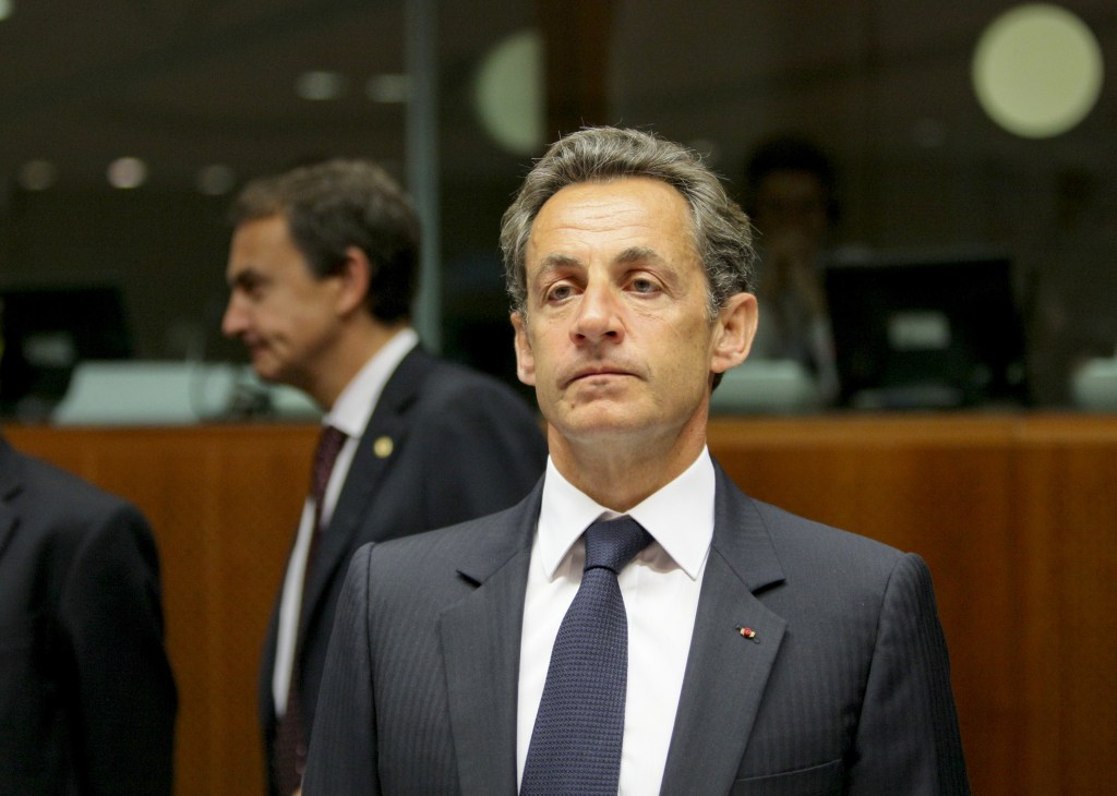 Nicolas Sarkozy in formal business attire at an official government meeting or EU summit.