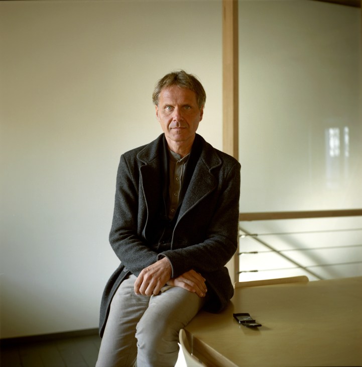 Michael Schindhelm, German author and film director and visiting curator at Strelka Institute, sitting on a window ledge.