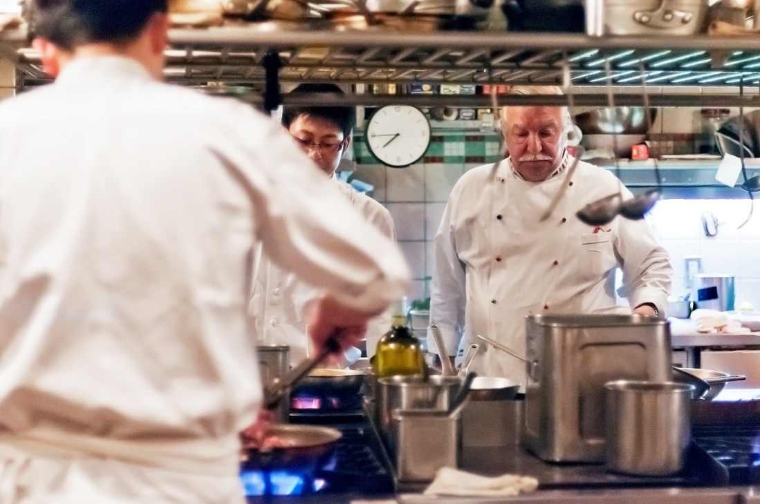 Head chef Giovanni Cenni watches a cook work in La Bisboccia's kitchen.