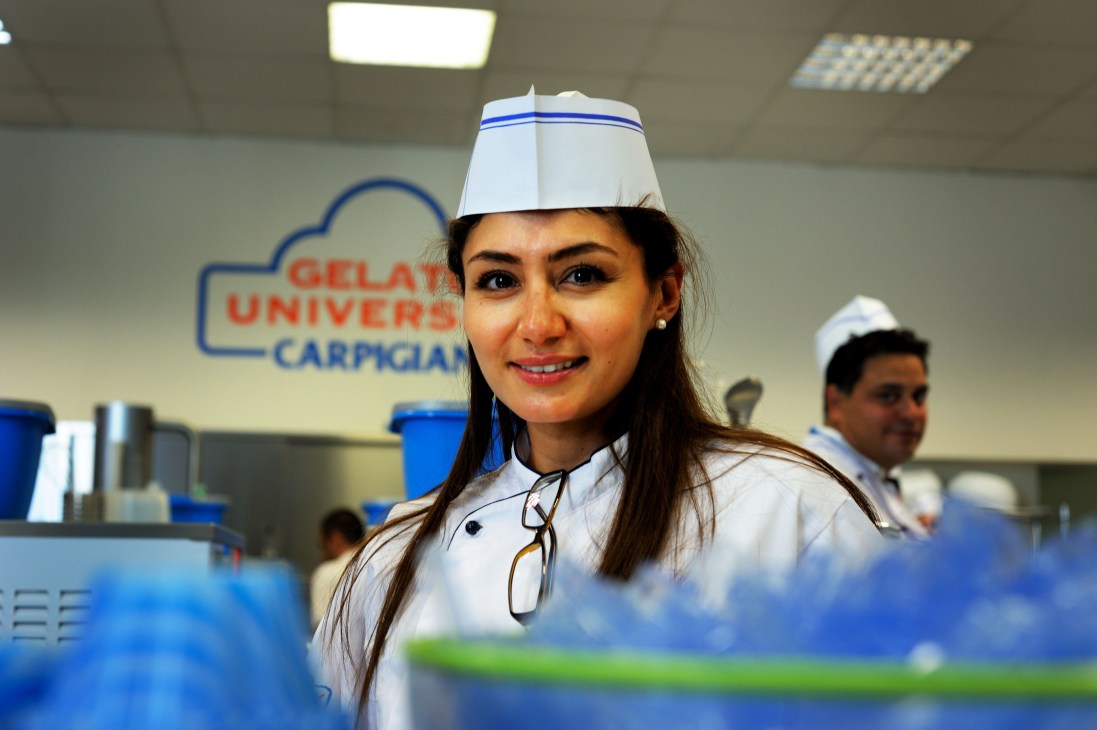 Dubai student Yasmeena Abdelghani wearing a white chef's hat and uniform at Carpigiani Gelato University.