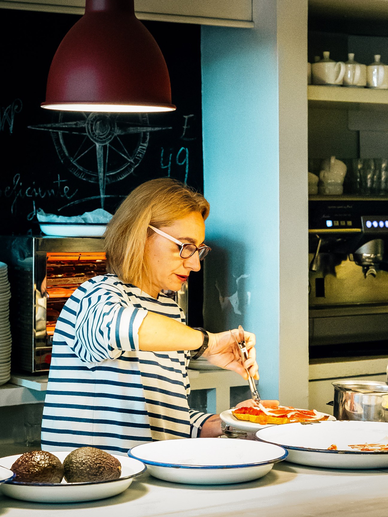 Chef in striped shirt preparing food at El Machi restaurant in Santander