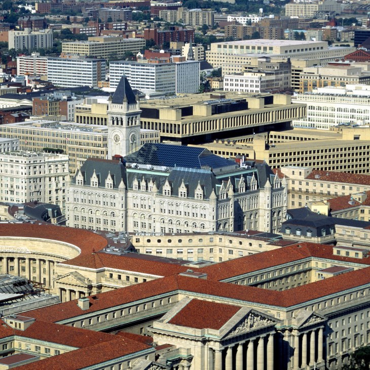 Aerial view of Washington DC showing the mid-rise skyline with historic government buildings and modern office structures.
