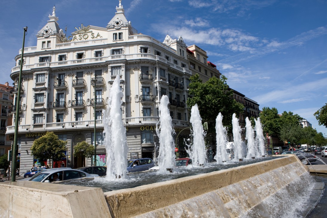 Glorieta de Bilbao square with fountains and Bourbon-era architecture in Madrid.