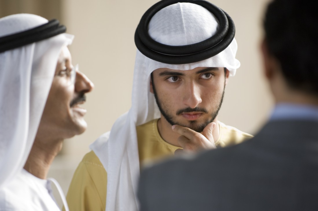 Sheikh Hamdan bin Mohammed bin Rashid Al Maktoum, crown prince of Dubai, wearing traditional white headwear and yellow shirt.