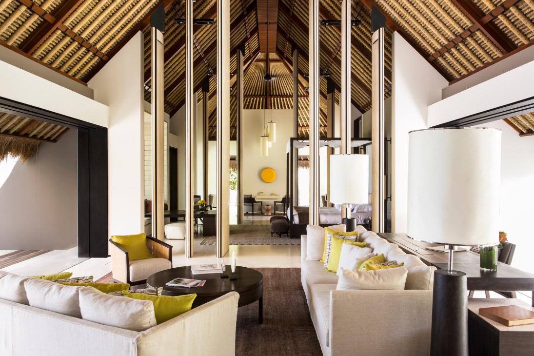 Modern luxury villa interior at Cheval Blanc Randheli with high ceilings, cream furnishings, and tropical design elements.