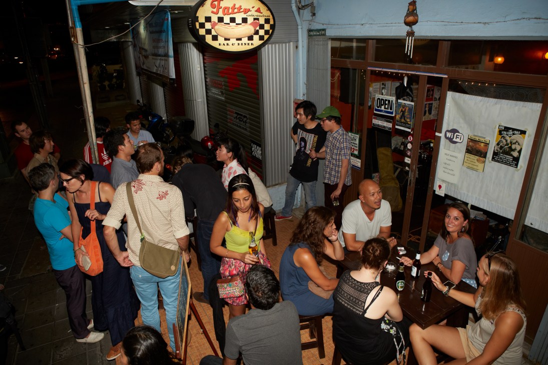 Patrons gather inside Fatty's bar venue, a mix of Thai and foreign attendees socializing in the casual nightlife space.