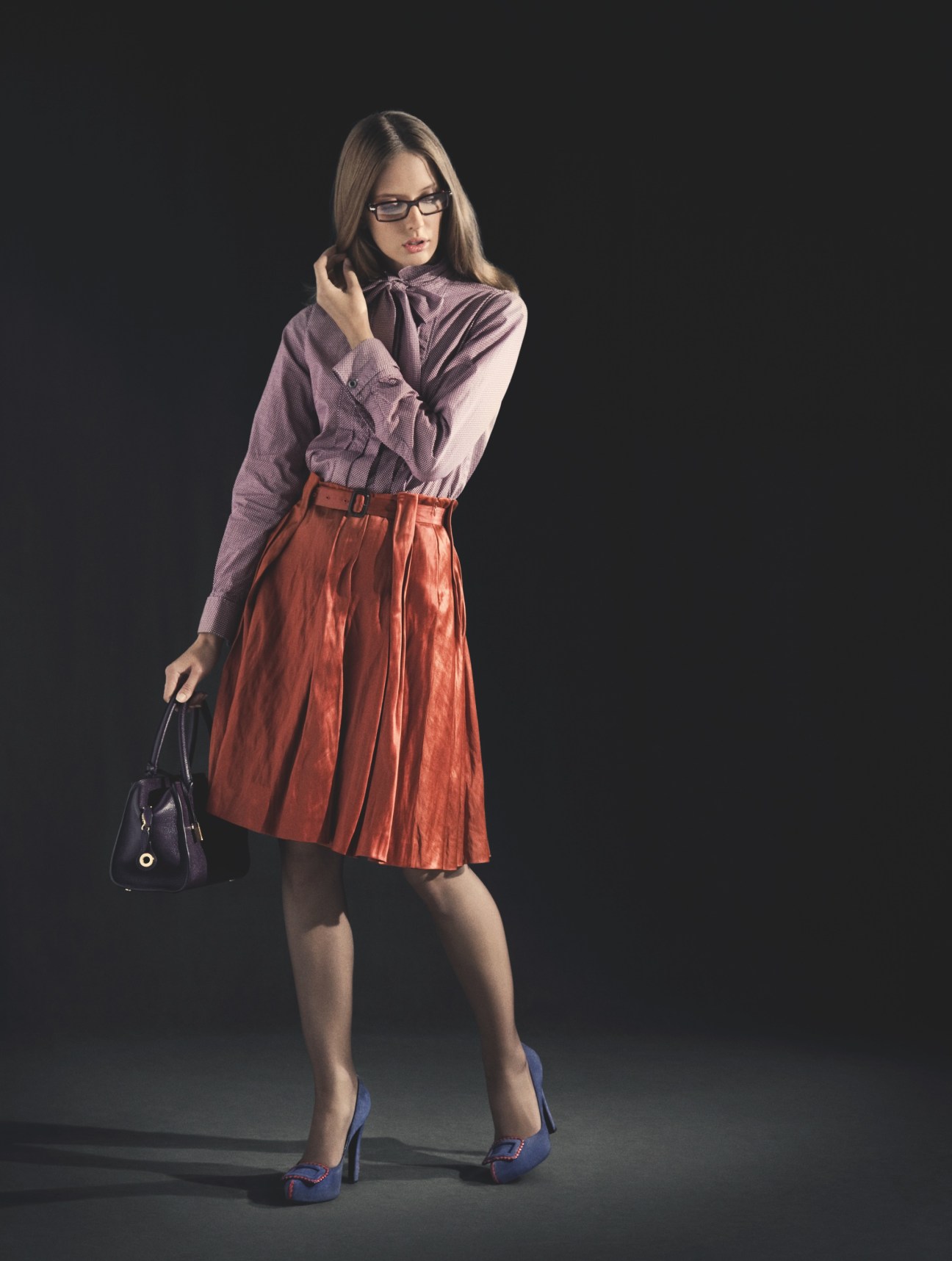 Model wearing Glanshirt shirt, Aspesi skirt, Falke tights, Roger Vivier shoes, Loro Piana bag and Persol glasses.