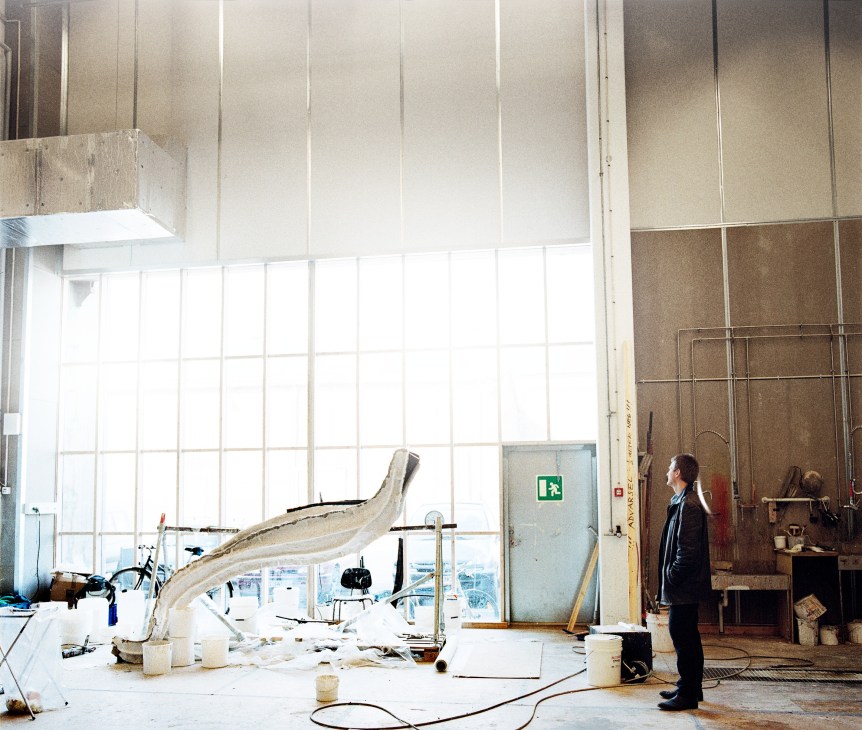 Esben Horn surveys a large clay mould of a thoracosaurus in a Copenhagen boatyard studio.