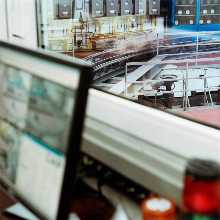 View of CargoCap test track through cockpit window with control panels and wiring visible