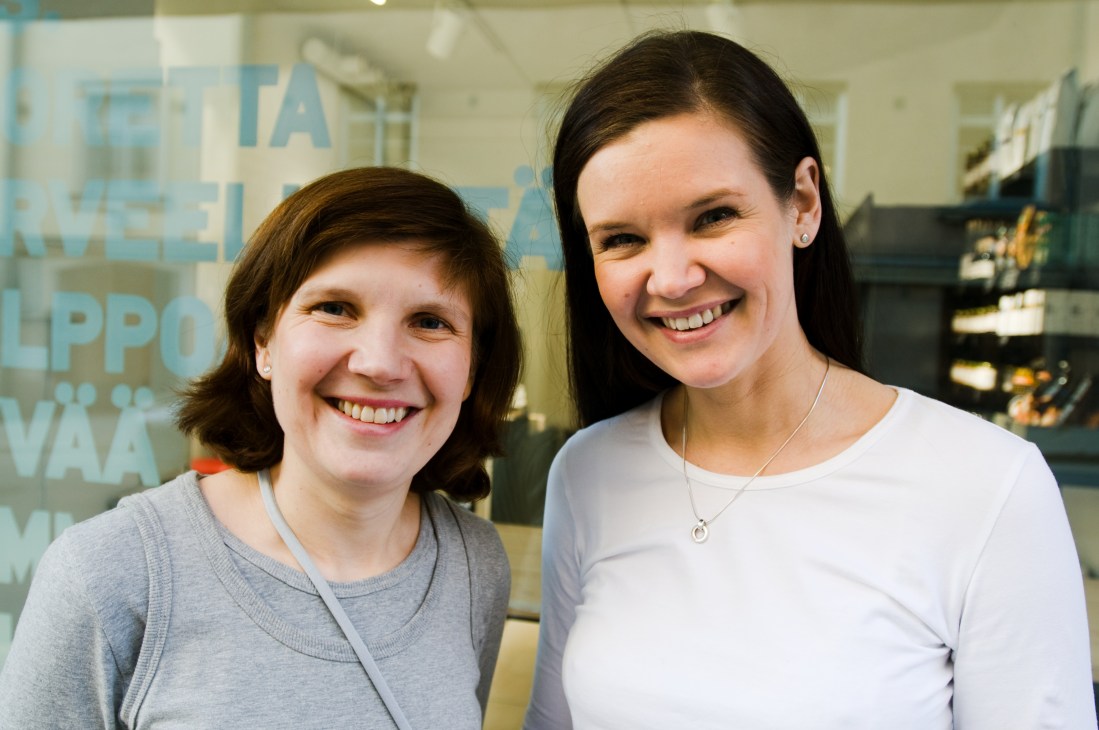 Sis founders Kaisa Leikola and Anu Syrmä smile at the camera inside one of their Helsinki delis.