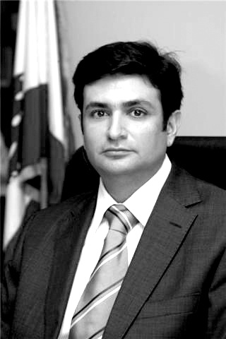 Selim Wardy, Lebanon's culture minister, in a black and white portrait photograph wearing a suit and tie.