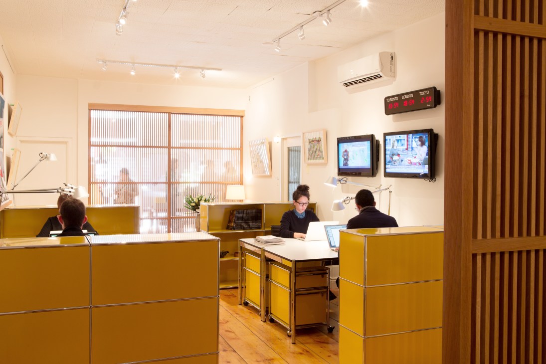 USM Haller modular furniture with yellow cabinets dividing the Toronto bureau office space.