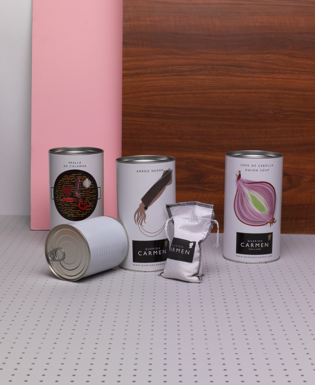 Querida Carmen tinned Spanish food products including paella, black squid-ink rice and onion soup with stylized label designs.