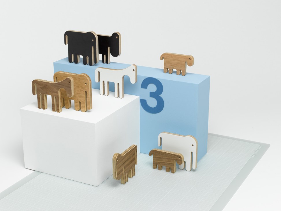 Unto This Last wooden animal ornaments arranged on numbered podiums designed by Olivier Geoffroy.