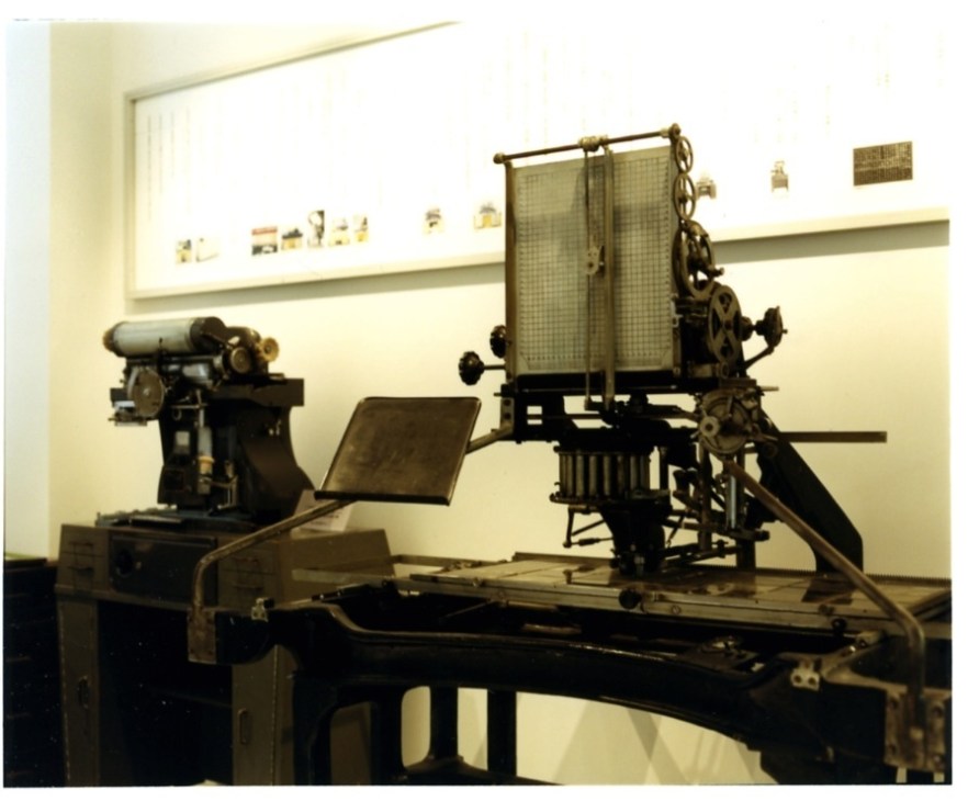 Vintage phototypesetting machines with mechanical components and glass screens displayed at Morisawa factory.