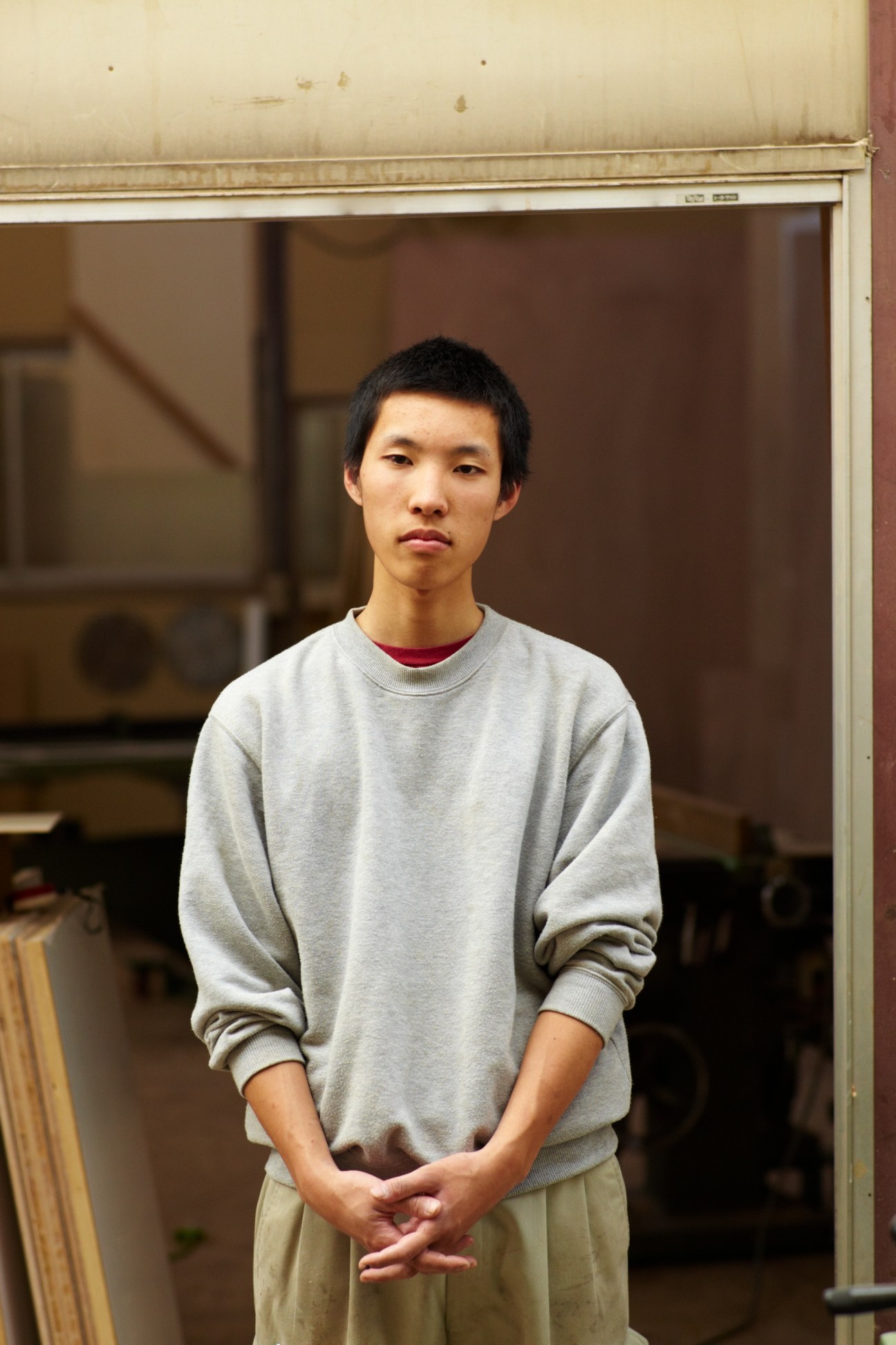 Portrait of Sho Ito, 18, a first-year apprentice at Akiyama Mokko furniture workshop in Yokohama.