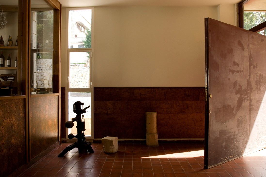 Entrance to the Château Musar tasting room with wooden doors and stone walls.