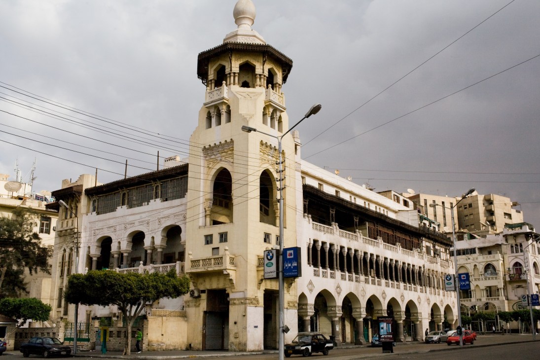 Early 20th-century Islamic-style building with ornate tower and arched colonnades in El Korba, Cairo