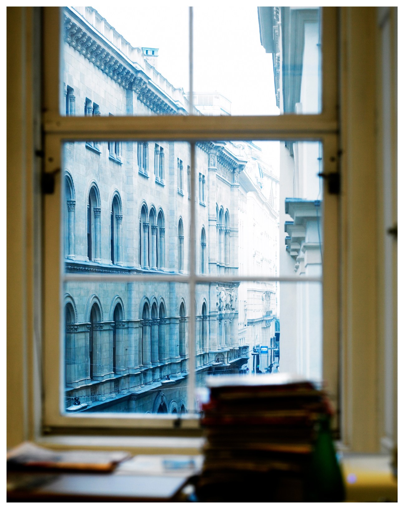 View through a window of classical Vienna architecture on Herrengasse street from an office.