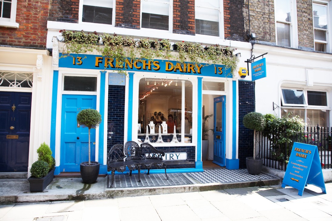 French's Dairy storefront with bright blue facade, white-trimmed windows and gold lettering on Lamb's Conduit Street.