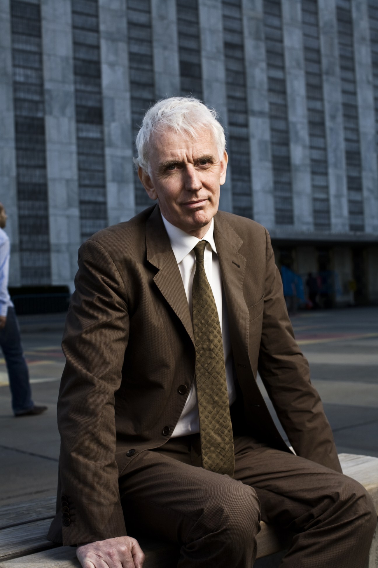 Steve Crawshaw, UN advocacy director at Human Rights Watch, seated outside UN headquarters building.
