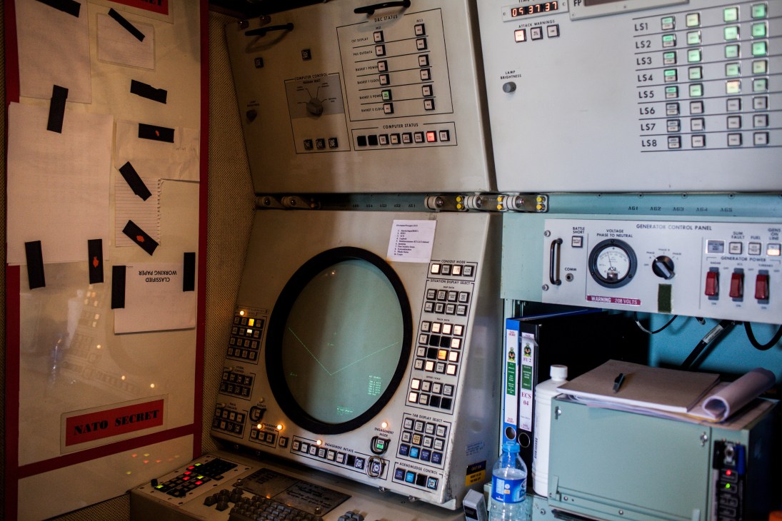 Control panels and radar screen inside the Dutch Patriot Engagement Control Centre.