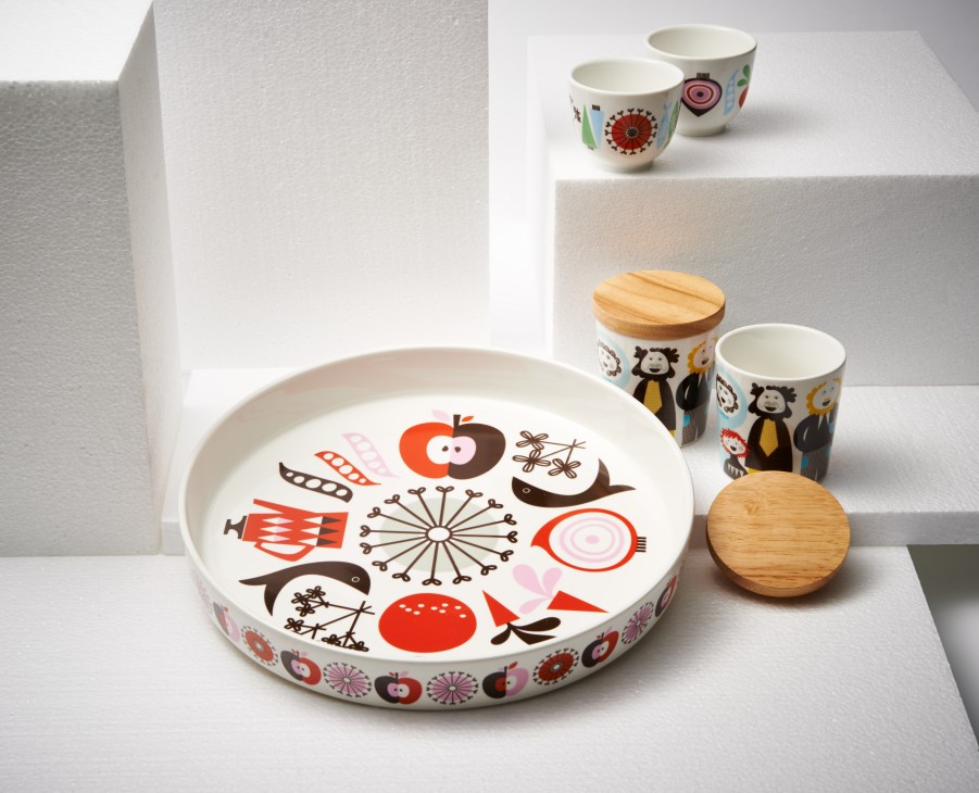 Isak porcelain kitchenware with signature characters and patterns includes a large plate, bowls, and wooden lids.