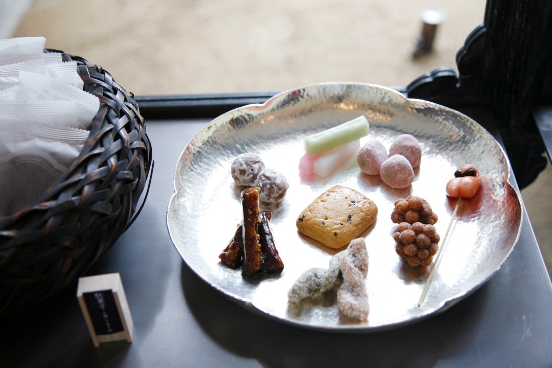 Japanese sweets and confectioneries arranged on a white ceramic plate at Baishinka, Tokyo.