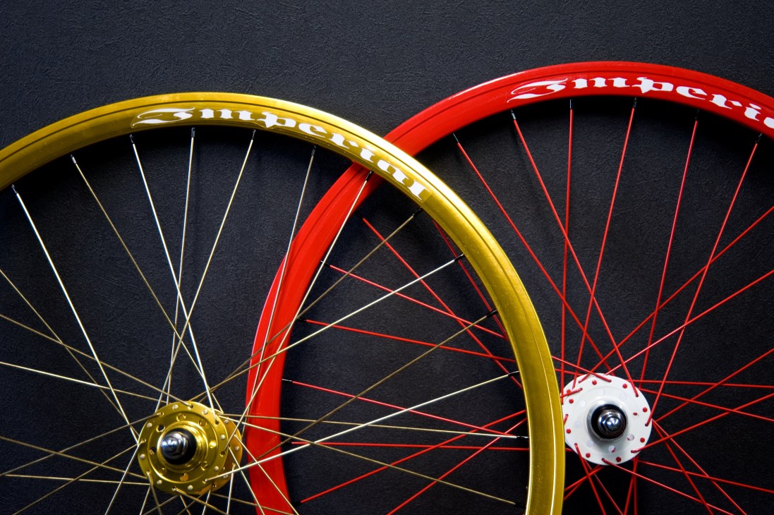 Colorful Funriki bicycle wheels featuring yellow and red rims with eight-spot SS design on dark background.