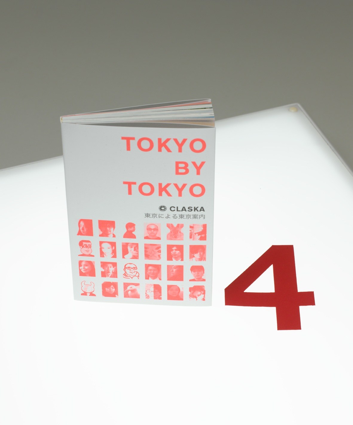 Claska's Tokyo guide with red text and illustrated portraits on white cover, displayed with number 4.