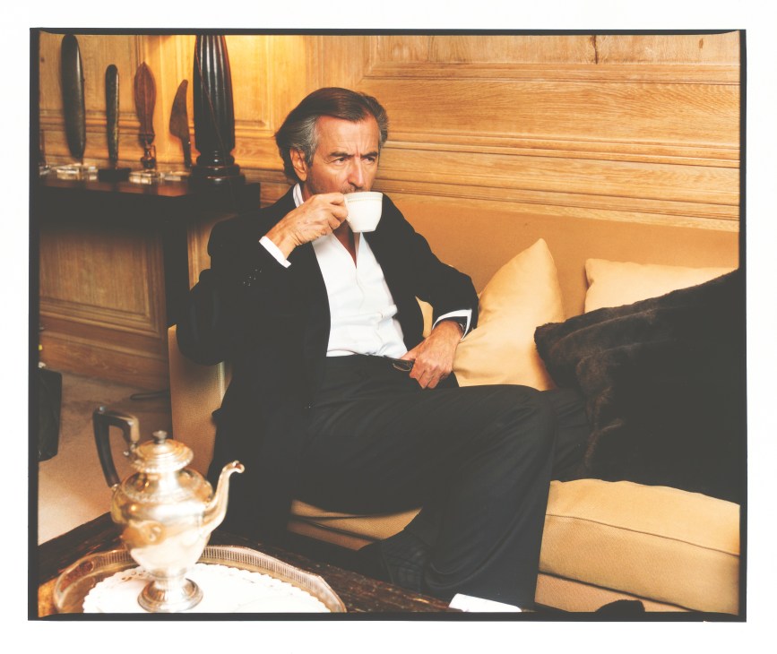 Bernard-Henri Lévy drinks tea in his wood-panelled Paris office.