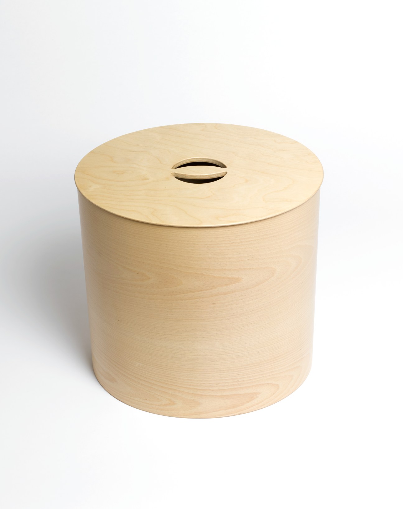Light wood cylindrical storage container with a lid featuring a narrow slot handle detail.