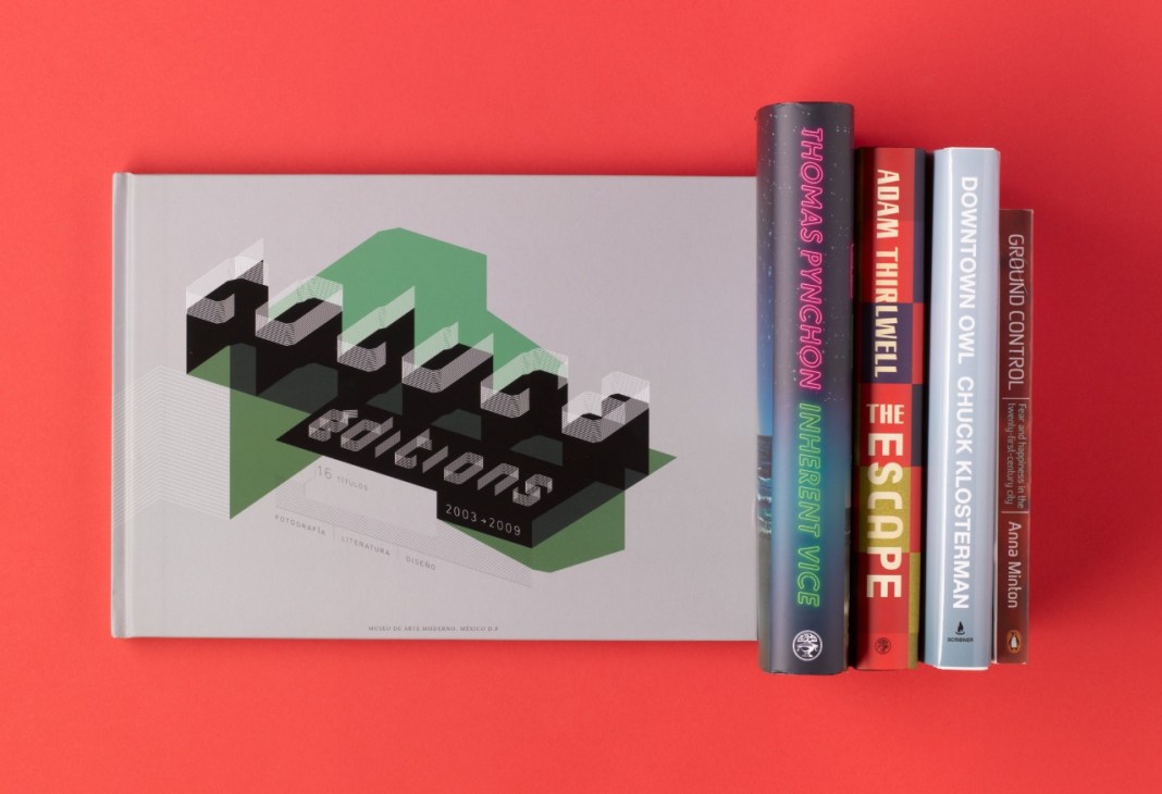 Selection of books displayed on a bright red background, including Toluca Editions design book and titles by Pynchon, Klosterman, Thirlwell and Minton.